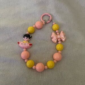 Pink and Yellow Beaded Phone Wristlet with Bow and Character Charm